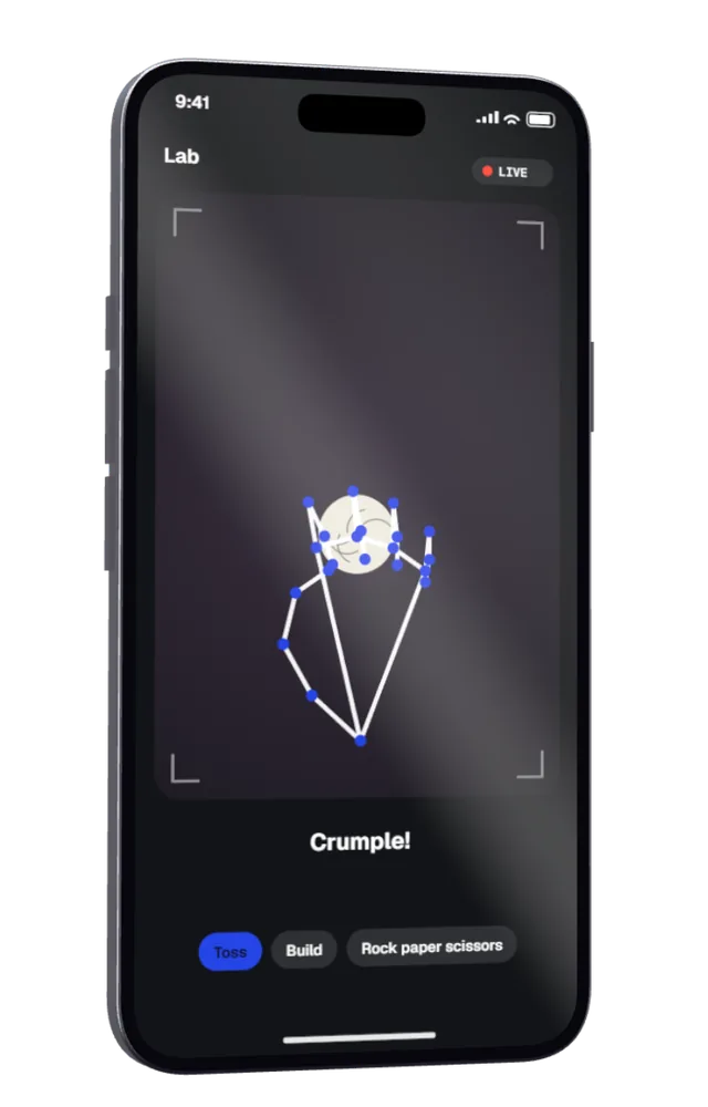 A phone camera view of a hand crumpling a page into a ball